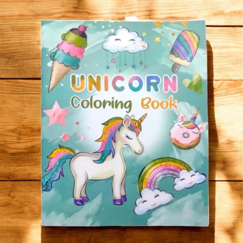 A vibrant Unicorn Coloring Book cover featuring a white unicorn, rainbow, ice cream, cupcakes, and clouds on a light blue background.