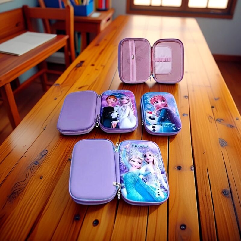 Several open Girls EVA Pouches displaying mixed themes including Frozen (Elsa, Anna, Olaf) and Disney Princesses (Ariel, Rapunzel, Cinderella), showing their spacious interiors on a wooden table.