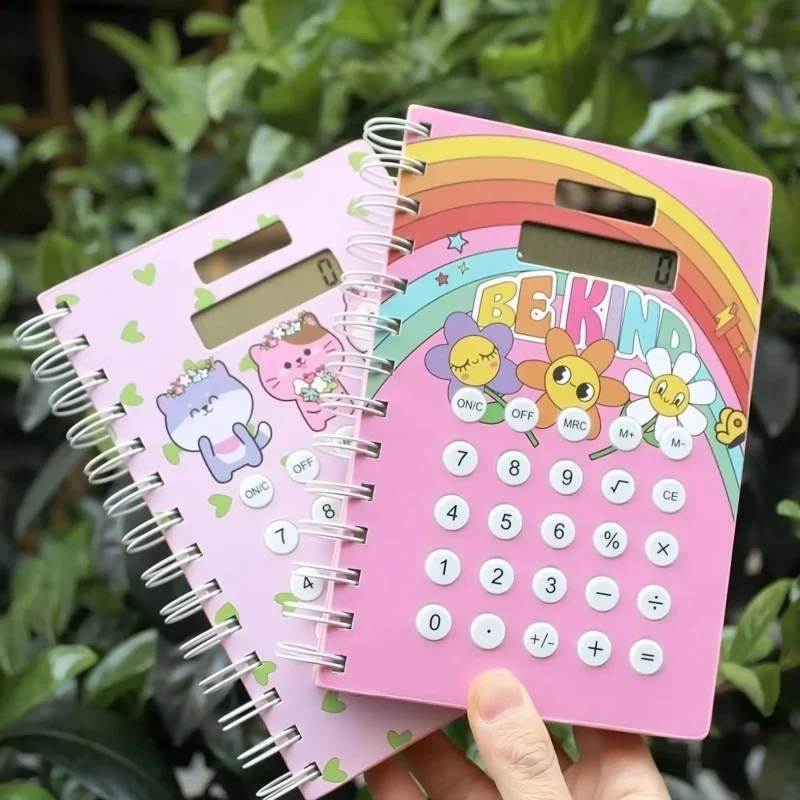 Two pink Calculator Diary 100 Pages with rainbow and cartoon cat themes, showing their spiral binding and calculator buttons.