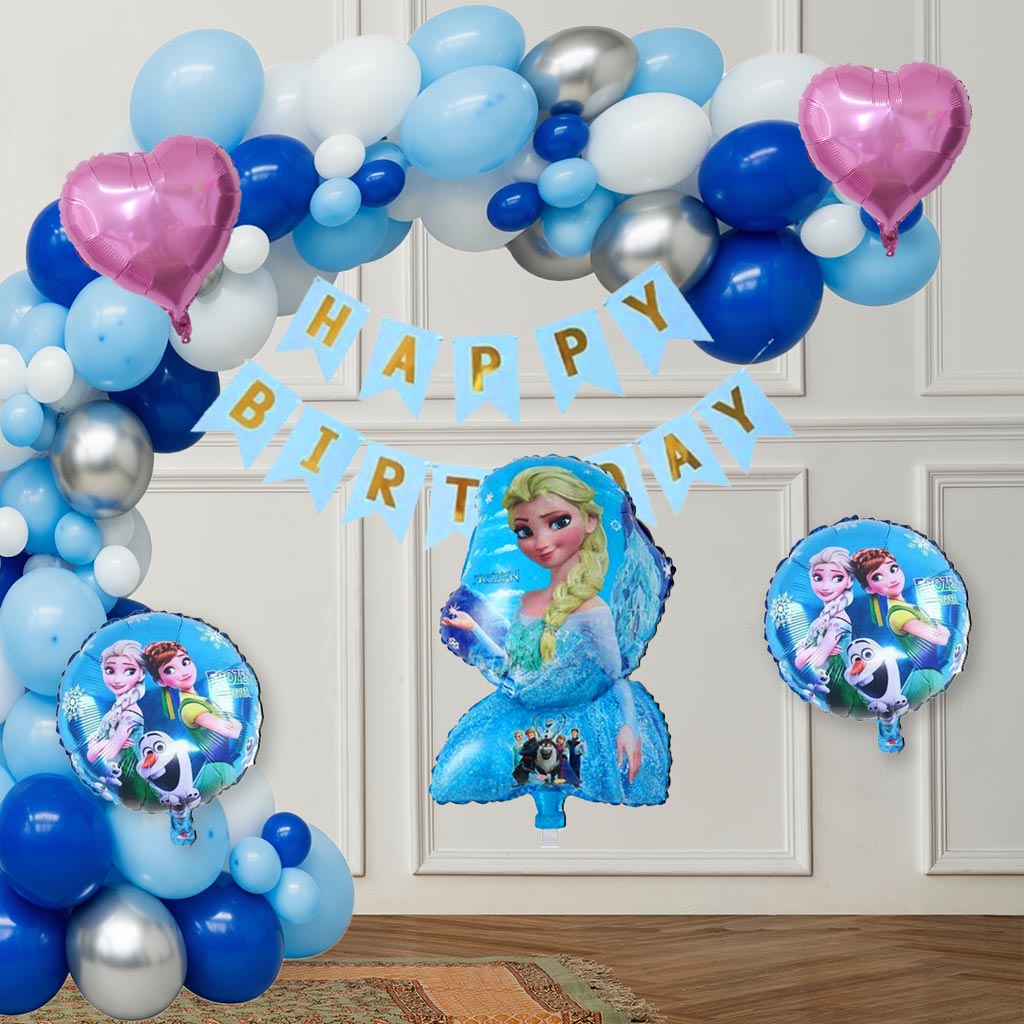 A large balloon arch decorated with blue, light blue, white, and silver metallic balloons, along with pink heart foil balloons and a 5-in-1 Frozen theme foil balloon set, creating an enchanting Frozen Theme Birthday Kit display.