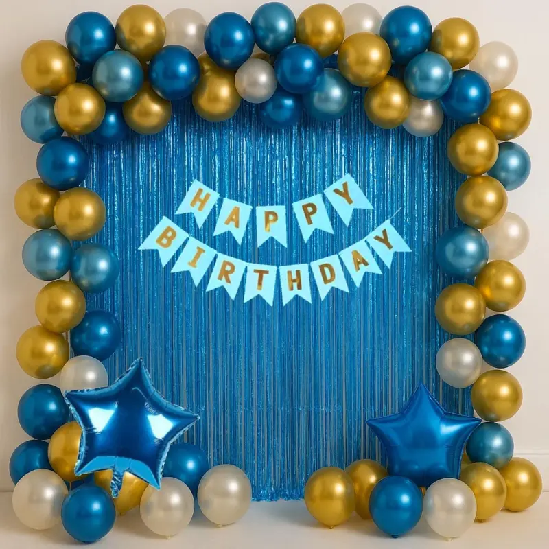A stunning party backdrop created using the Dazzling Blue Gold Theme Kit, featuring a vibrant arch of blue, gold, and silver chrome balloons, with blue star foil balloons, and a blue "Happy Birthday" banner against a blue foil curtain.