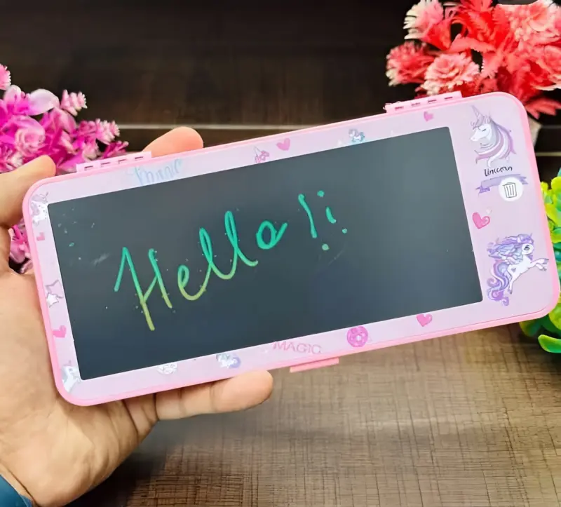 A pink Innovative LCD Writing Box with a unicorn theme on its closed lid, showing a colorful "Hello!" message written on the LCD screen.