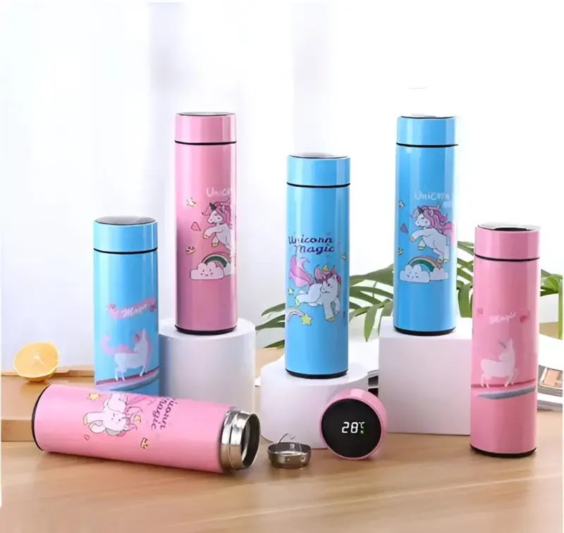 A group of colorful unicorn-themed Thermal Bottle with Displays in pink and blue, some showing their digital temperature readings and stainless steel filters, on a wooden surface.