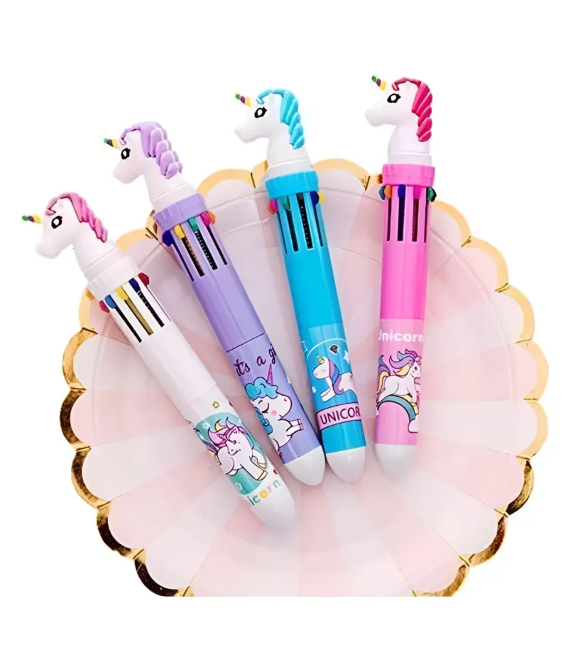 Four colorful Unicorn 10-in-1 Pens (white, purple, blue, pink) with unicorn toppers, arranged on a pink scalloped plate, showcasing their designs.